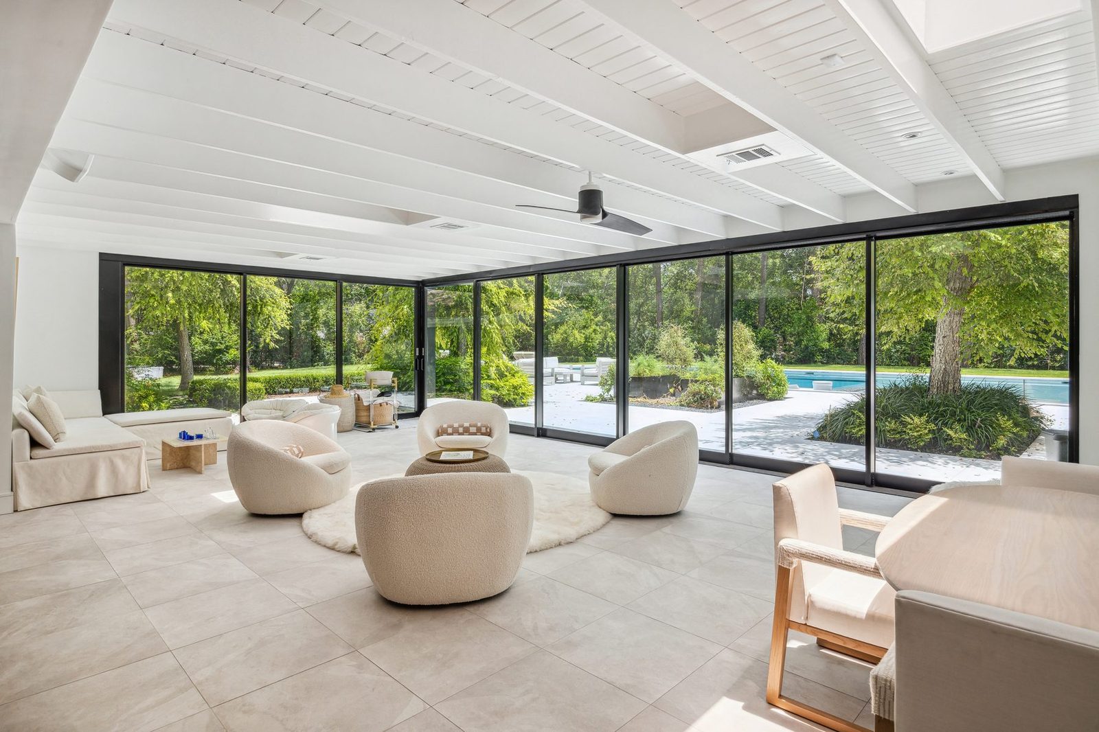 Shadow Sanctuary solarium opening onto wooded grounds.